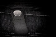 Button clasp of black Iron Sights Club Collar Denim Vest
