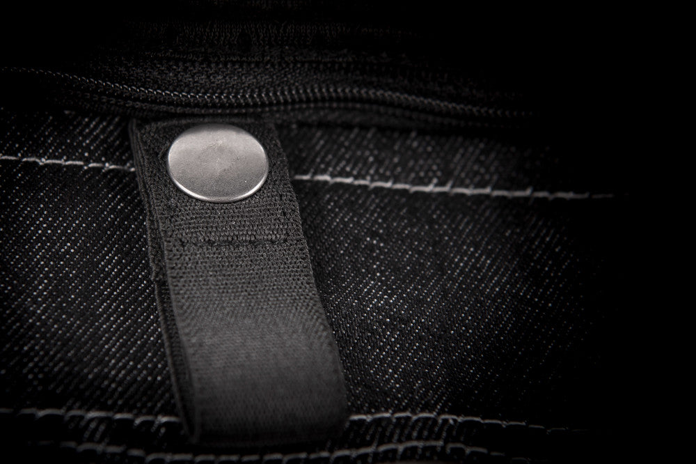 Button clasp of black Iron Sights Club Collar Denim Vest