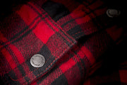 Detail shot of the pattern on the Marksman Flannel in red and black