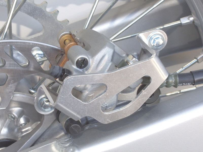 Works Alum Rear Caliper Guard KX KDX KLX - 25-020 For Kawasaki Dirt Bikes 1989-2007 | Suzuki RM 65 2003-2004