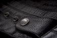 Primer jacket in black showcasing button clasp