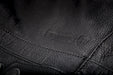 Primer jacket in black showcasing leather material
