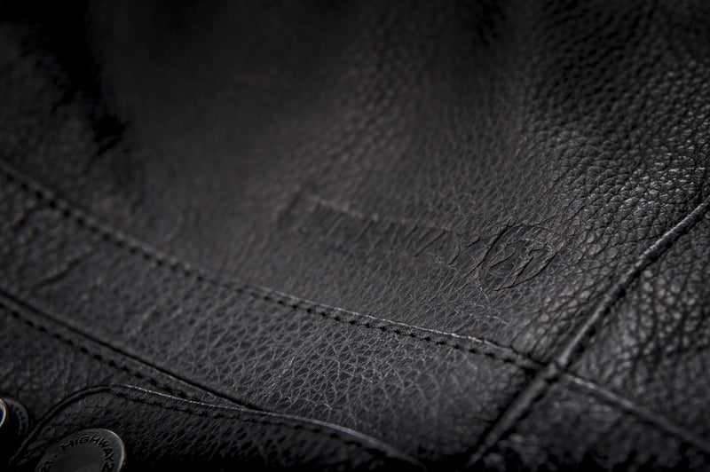 Primer jacket in black showcasing leather material