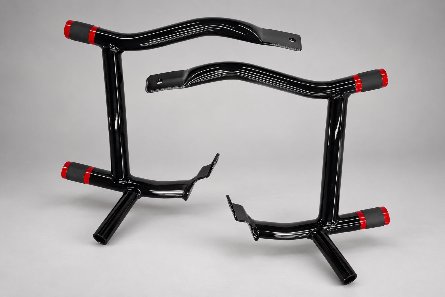Touring bag guards. Black guards with red-accent end caps shown.